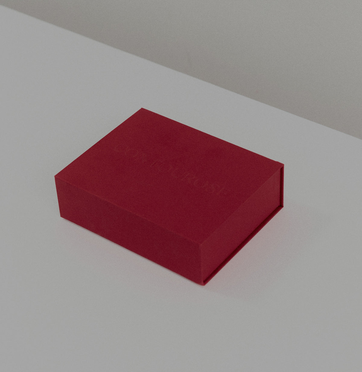 Burgundy Contourose gift box with embossed logo