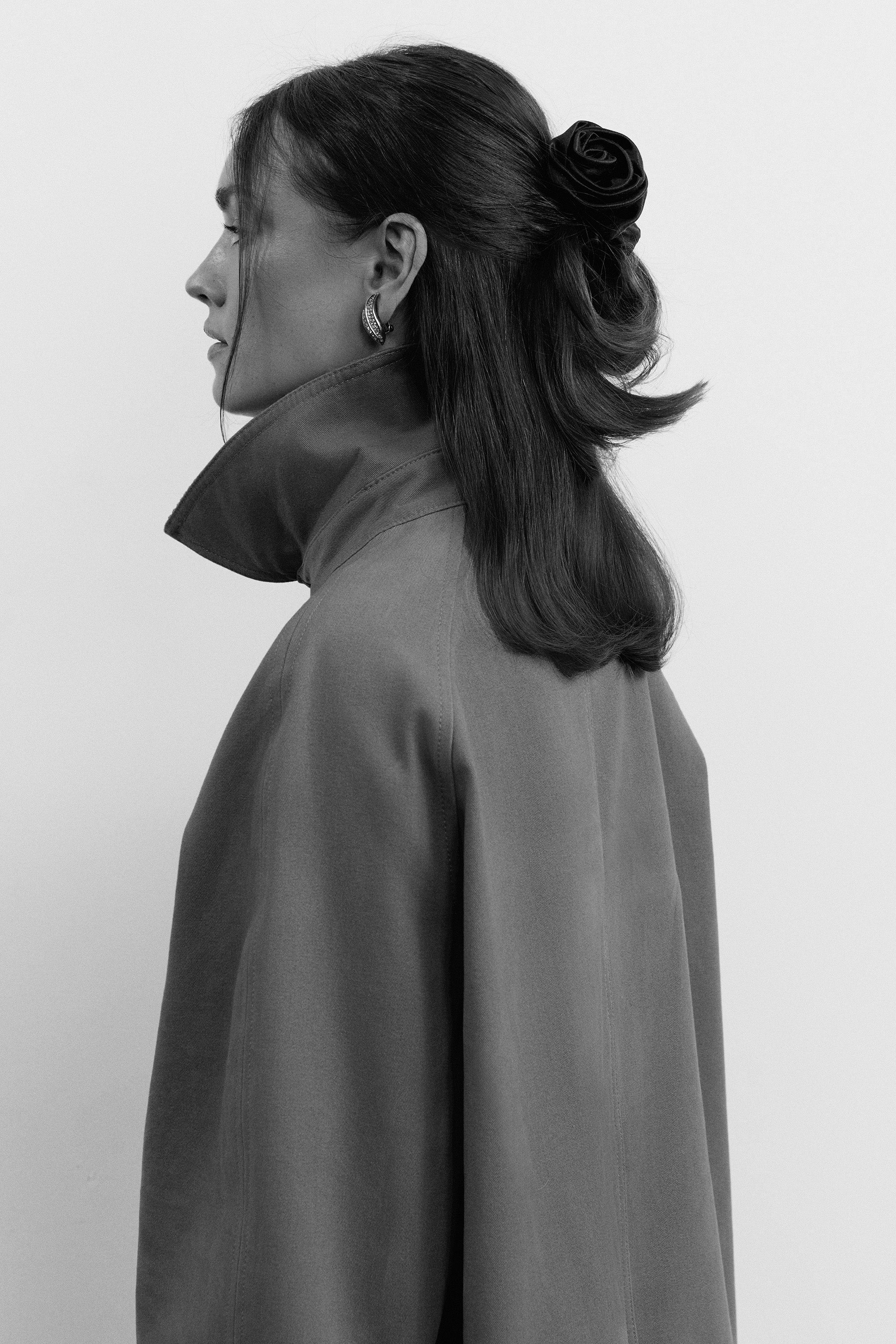 On-model back view in trench coat with black scrunchie - CONTOUROSE