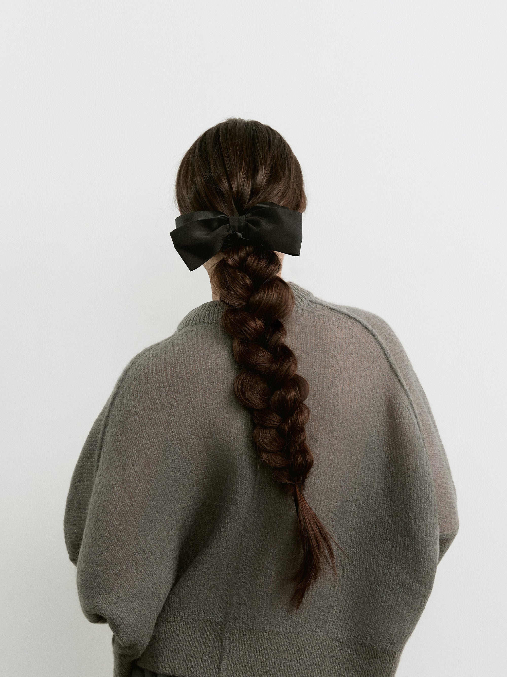 Hair bow scrunchie in Black - on-model, back view - CONTOUROSE