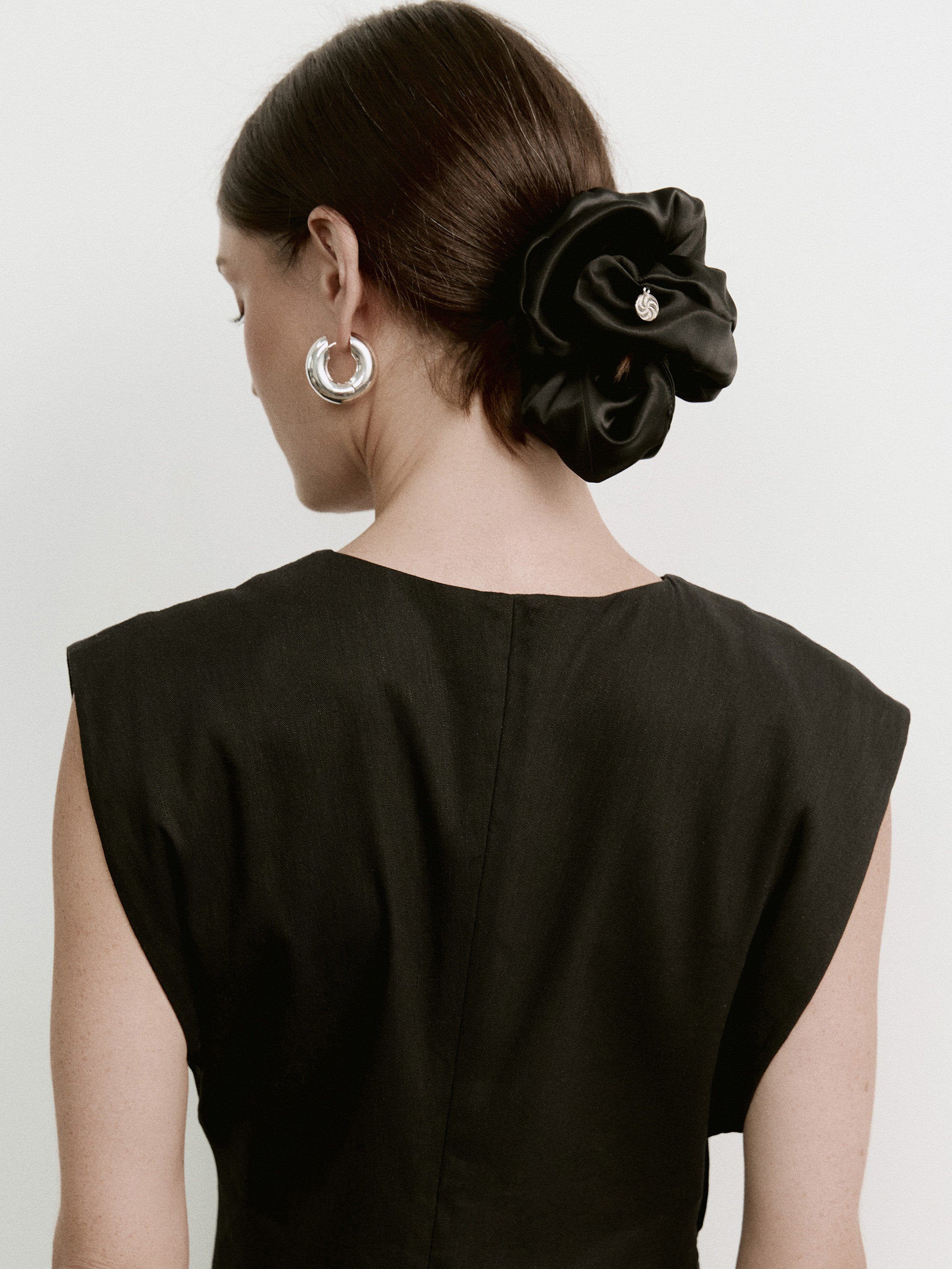 Oversized silk scrunchie in Black - on-model, back view - CONTOUROSE