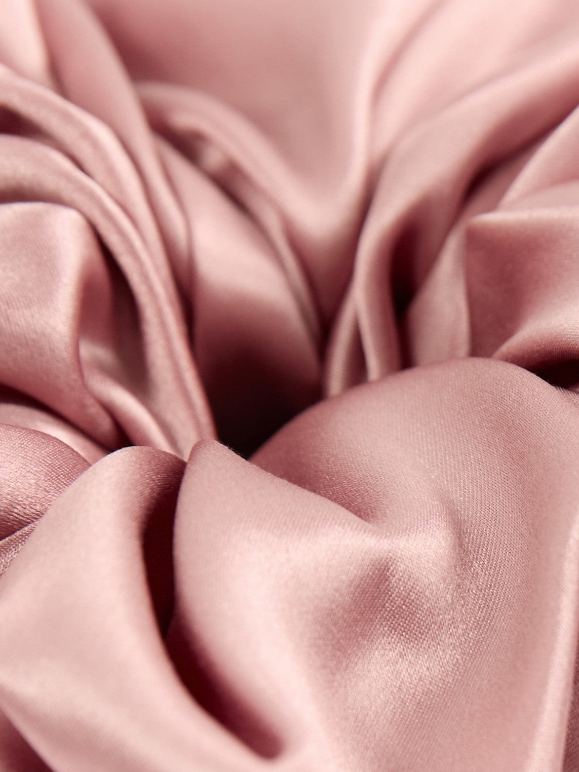Oversized silk scrunchie in Dusty Pink - packshot, on material - CONTOUROSE