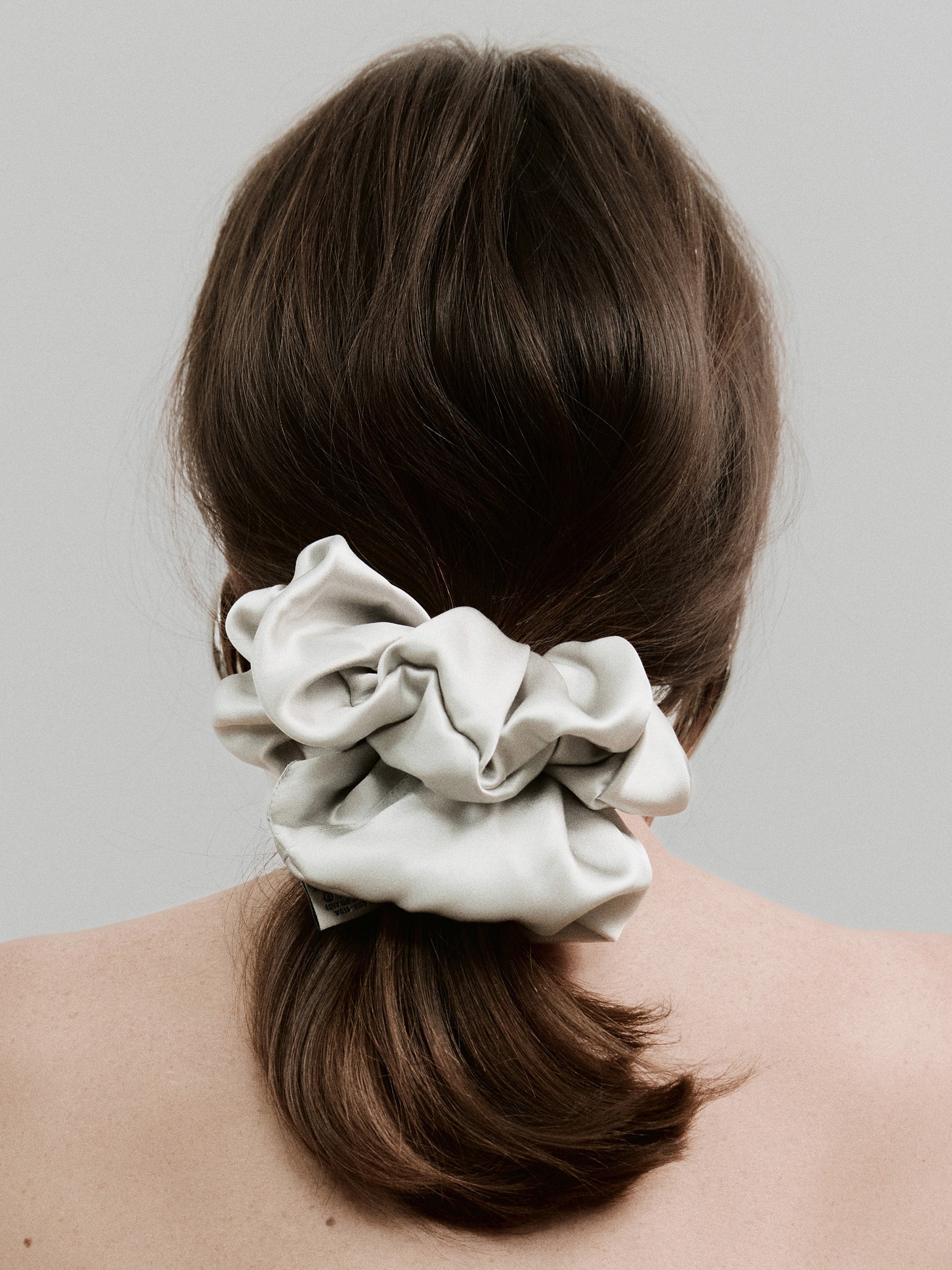 Oversized silk scrunchie in Silver Gray - on-model, back view - CONTOUROSE